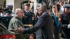 Defense Secretary Lloyd Austin, right, greets Ukraine's Defense Minister Rustem Umerov during an arrival ceremony at the Pentagon, near Washington, July 2, 2024.