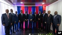 Members of Haiti's new transitional council pose for a group photo during an installation ceremony in Port-au-Prince, Haiti, April 25, 2024.