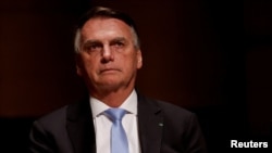 FILE PHOTO: Brazil's former President Jair Bolsonaro attends an event at the Municipal Theatre in Sao Paulo