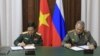 Đại tướng Phan Văn Giang và Đại tướng Sergei Shoigu ký các văn kiện hợp tác, ngày 1/12/2021. (Photo: TTXVN via MOD.gov.vn)