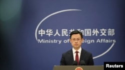 FILE - Chinese Foreign Ministry spokesperson Guo Jiakun conducts a press conference, in Beijing, Jan. 7, 2025.