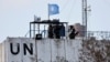 FILE PHOTO: United Nations peacekeepers (UNIFIL) look at the Lebanese-Israeli border